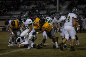 Freshman defensive lineman Davyon Duhart goes after the Scottsdale running back. He has an excellent junior college GPA, so after the season is over he plans to go to a four year university and try to walk on to their football team. (Photo by Sarah Farrell)