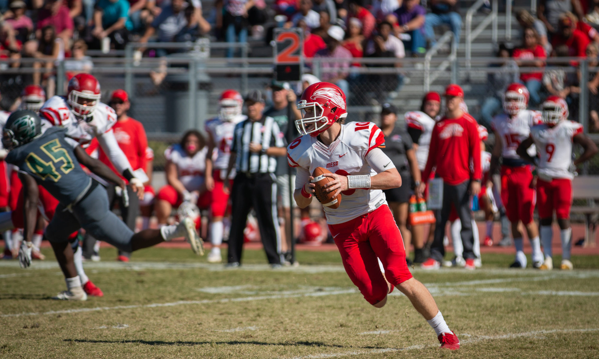 Sophomore quarterback Tyler Worrell rolls out to pass against Scottsdale. Worrell is just one of the Mesa players looking to move on to a four year university next season. (Photo by Sarah Farrell)