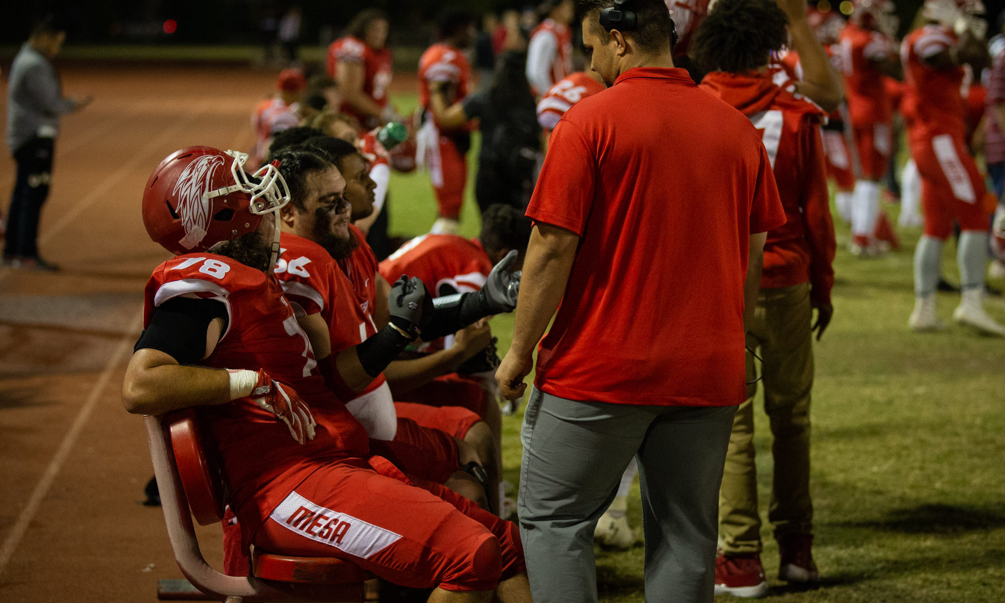 The Mesa offensive line gets some coaching during their final home game Nov. 10. The Thunderbirds got the 37-12 win over Phoenix College. (Photo by Matthew Roy)