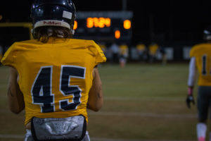 Freshman linebacker Kester Olsen takes a minute to mentally prepare before the final home game at Phoenix College. He is just one of many players on the Bears' roster from outside of Arizona. (Photo by Chris Lindsay)