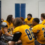 Players go through their final preparations before taking the field. Many still have aspirations to continue playing football. With football ending in Maricopa County after this season they will have to try and get a scholarship, walk on to another program or transfer to another junior college. (Photo by Chris Lindsay)