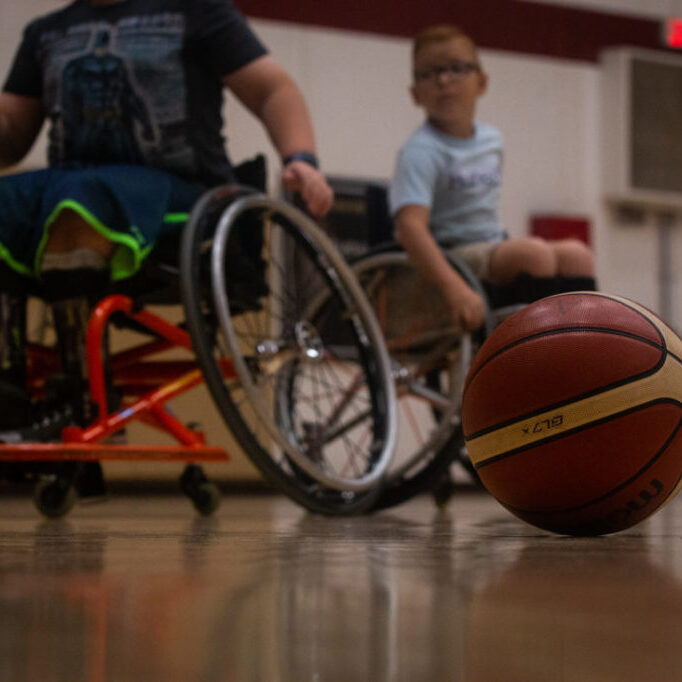 Adaptive sports are expensive, but coaches tell us they have never had to reject an athlete from participating, thanks to donations and scholarships.  Program supervisor, Taylor Wilson, tells us, "These programs bring confidence to the players and help them find people who are just like them." (Photo by Owain Evans)