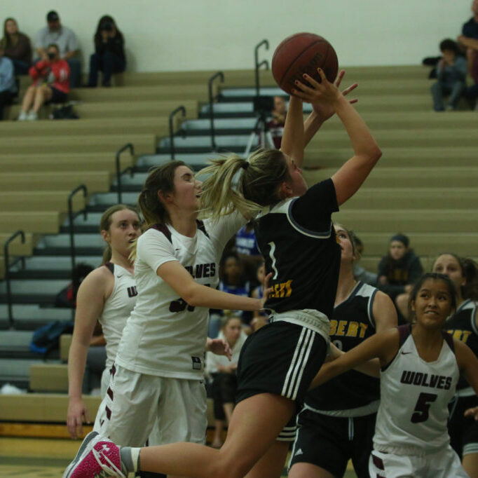 Haley Cavinder gets fouled while driving to the hoop. Haley was the Tigers' leading scorer last season averaging 23 points per game. (Photo by Tyler Dunn)