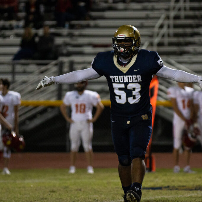 Senior Sebasthian Mingot celebrates the end of the third quarter. The defensive tackle forced the first turnover of the game against Chaparral. (Photo by Kyla Wilcher)